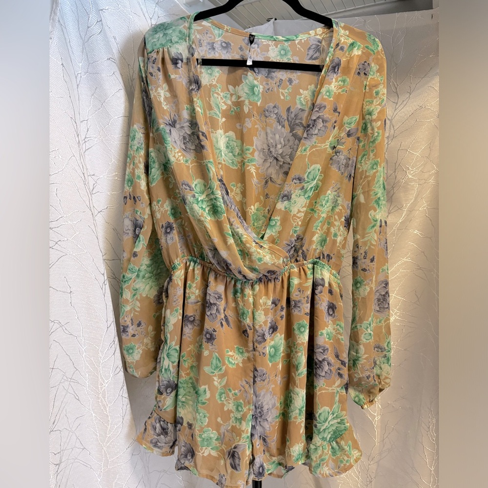 Tan flowy long-sleeved shorts romper with floral design
